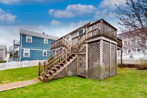 a house with a staircase in a yard at The Bradford Bistro in Provincetown