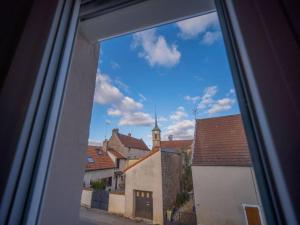 a view from a window of a city with buildings at By les Climats - La Grande Rue in Perrigny-lès-Dijon
