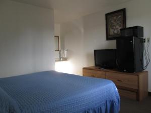 Ein Bett oder Betten in einem Zimmer der Unterkunft Motel 10