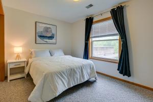 a bedroom with a bed and a window at Dog-Friendly Baraboo Vacation Rental with Yard! in Baraboo