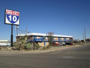 a motel sign on the side of a street at Motel 10 in Lordsburg