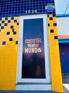 a door to a hostel morocco mind sign on a building at Hostel Meio do Mundo in Macapá