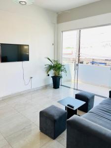 a living room with a couch and a table at Hostel Meio do Mundo in Macapá