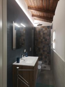 a bathroom with a sink and a toilet at Ai Campanili in San Severo