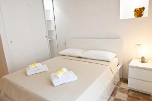 Mimosa e Agave Blu tesisinde bir odada yatak veya yataklar