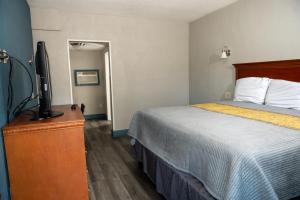 Cama o camas de una habitación en Riverside Inn and Suites