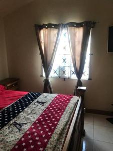 a bedroom with a bed and a window at Leila VIllage Plus in Mendes +13 photos