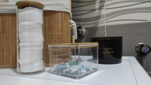 a table with an aquarium with a candle and towels at Studio 13 in Kragujevac +34 photos