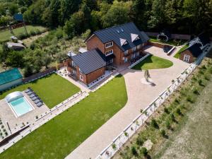 an aerial view of a large house with a yard at Rustyfox in Remetské Hámre
