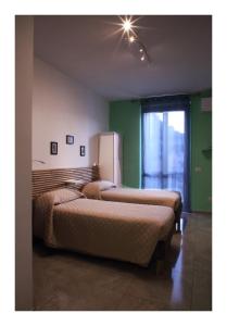 Llit o llits en una habitació de Casa Vacanze Piazza Padella