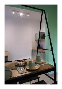 a dining room table with a mirror on it at Casa Vacanze Piazza Padella in San Severino Marche +7 photos