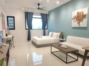 a living room with a couch and a table at Chambers Suites KL - by Staycation Homes in Kuala Lumpur