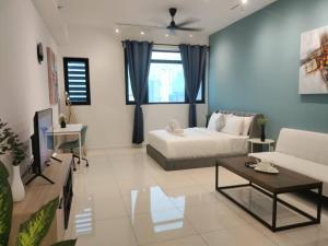 a living room with a couch and a table at Chambers Suites KL - by Staycation Homes in Kuala Lumpur