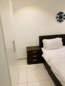 Ένα ή περισσότερα κρεβάτια σε δωμάτιο στο The VVIP Luxury Apartments @ Gardens