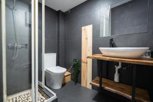 a bathroom with a sink and a toilet at El Mirador in Alicante