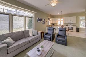 a living room with a couch and chairs and a kitchen at Waterfront Jackson Mansion Patio, Grill, Dock! in Jackson