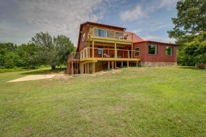 a large house on a grassy field in front at Secluded Harrison Retreat Near Buffalo Natl River in Harrison