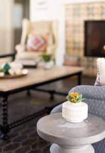 a white cake sitting on a table in a living room at La Serena Villas, A Kirkwood Collection Hotel in Palm Springs