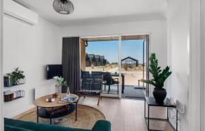 a living room with a couch and a table at Havnehusene, Lejl, 49 in Slagelse