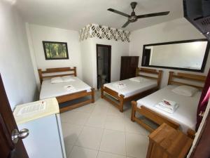 Postel nebo postele na pokoji v ubytování Hotel Malecon Puerto Berrio