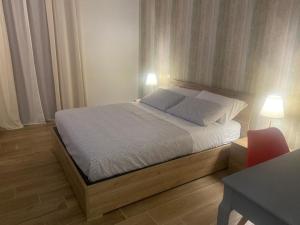 Postel nebo postele na pokoji v ubytování Il Pavone