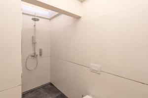 a bathroom with a shower and a glass wall at VILLA ACTEA in Vasto