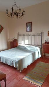 Łóżko lub łóżka w pokoju w obiekcie Casa Bomboniera
