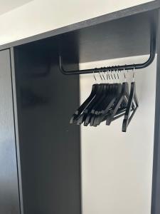 a rack of cooking utensils hanging from a counter at Seeapartment in Prien am Chiemsee