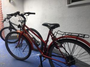 two bikes are parked next to a building at Dolores in Tešanj