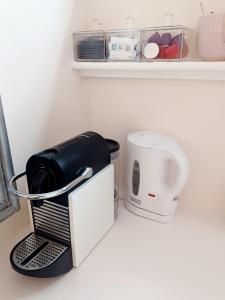 a coffee maker and a toaster sitting on a counter at The Little Limes - Ensuite Double Room Own Entrance in Art Deco House in Kent