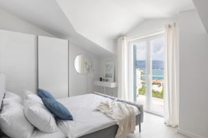 Postel nebo postele na pokoji v ubytování Apartments Marina
