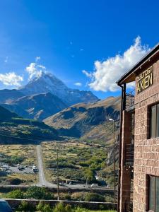 a view of a mountain from a building at Hotel Axien Kazbegi in Kazbegi