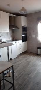 Kuchyň nebo kuchyňský kout v ubytování Apartamento Los Arcos