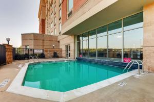 a swimming pool in front of a building at Drury Inn & Suites Montgomery in Montgomery