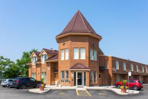 a brick building with a tower on top of it at Super 5 Inn in Mississauga