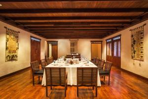 a large dining room with a table and chairs at The Oberoi Beach Resort, Lombok in Tanjung