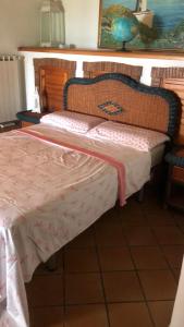 Säng eller sängar i ett rum på Villa panoramica Circeo