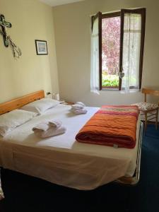 Postel nebo postele na pokoji v ubytování CASA ILARIA