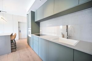 a kitchen with a sink and a counter at Charming 1BR Apt in Authentic Bauhaus Building in Tel Aviv