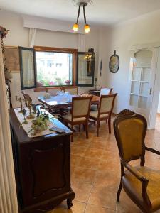 a kitchen and dining room with a table and chairs at ANASTASIAS HOUSE in Agios Nikolaos
