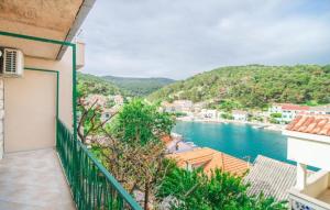 a balcony with a view of a body of water at Apartment Ina in Povlja