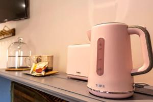 a pink toaster sitting on top of a counter at Hall View Guest Suite in Nunnington