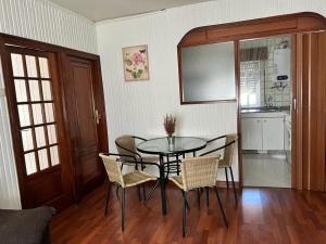 a dining room with a table and chairs at Casa Ángeles in Marín