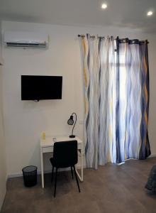 TV a/nebo společenská místnost v ubytování Kamome Rooms