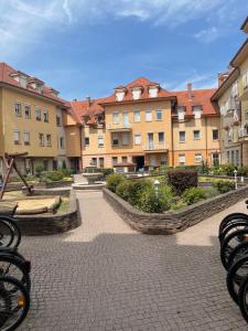 a group of buildings in a courtyard at Apartman 44 in Sopron