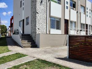 a building with a gate in front of it at Luz de Faro, frente a las playas mas lindas! in Mar del Plata
