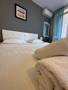 A bed or beds in a room at La Kameya