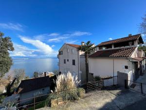 a house with a view of the water at Mali Stan Opatija in Opatija