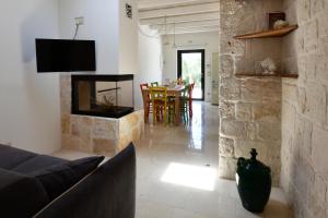 Μια τηλεόραση ή/και κέντρο ψυχαγωγίας στο Trulli di Titti - Luxury Country House