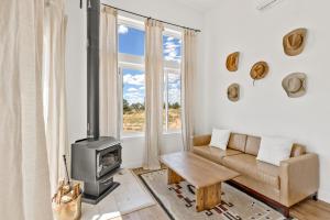 a living room with a couch and a stove at The Grand Canyon Headquarters in Valle